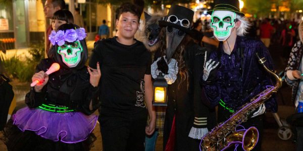characters of the parade of mischief parade with guests at Downtown Summerlin