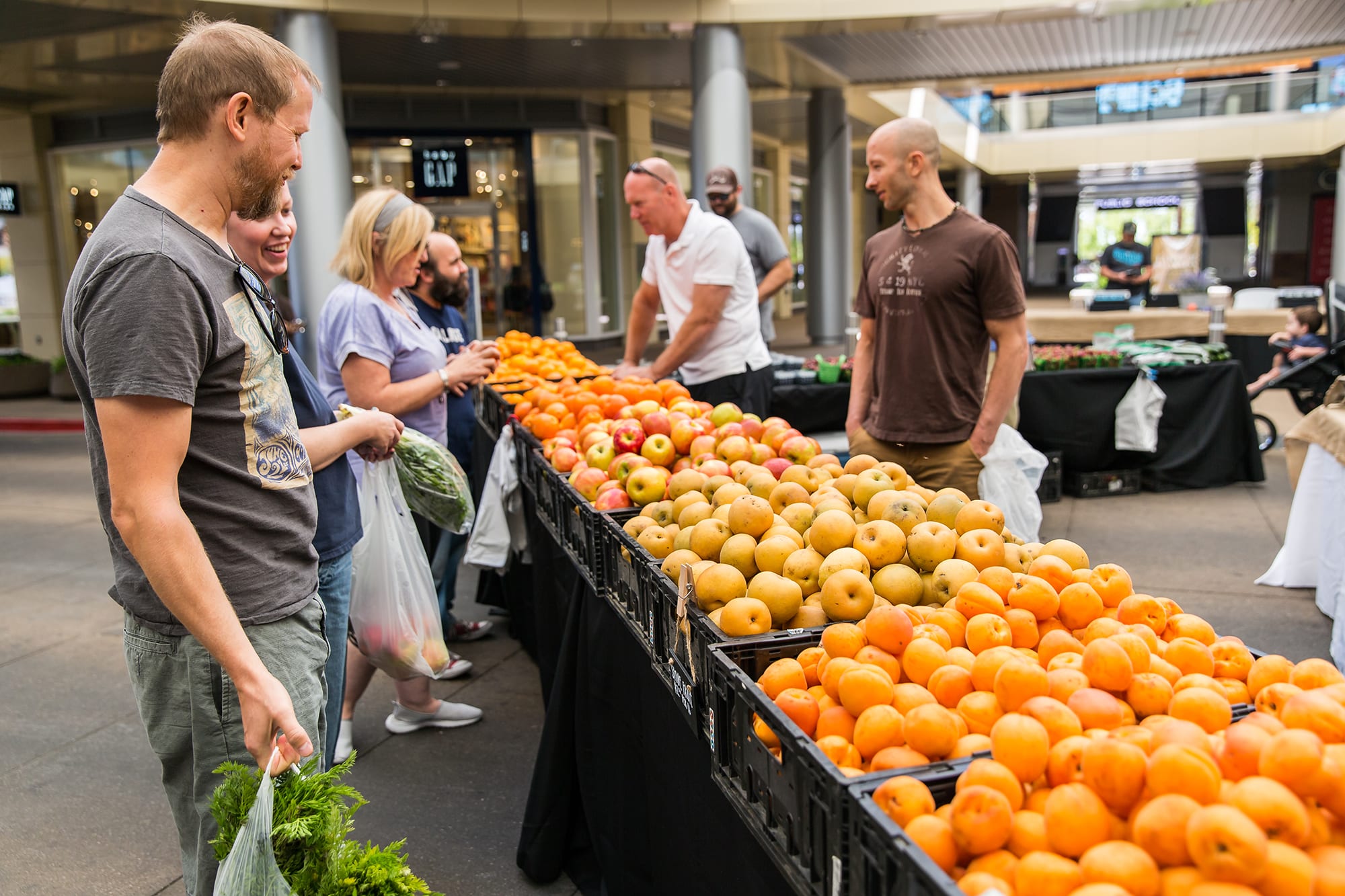 People buying produce at the Downtown Summerlin Farmers Market