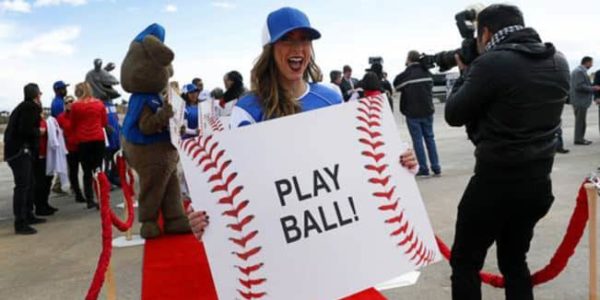 Girl holding a play ball sign at Las Vegas Ballpark groundbreaking