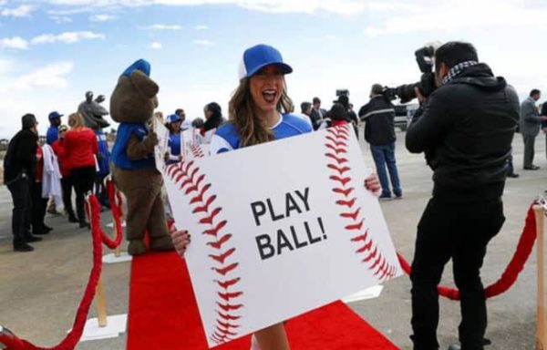 Girl holding a play ball sign at Las Vegas Ballpark groundbreaking