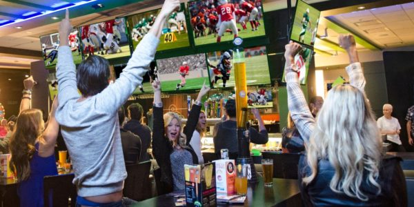 People watching football and cheering at Dave and Busters Downtown Summerlin