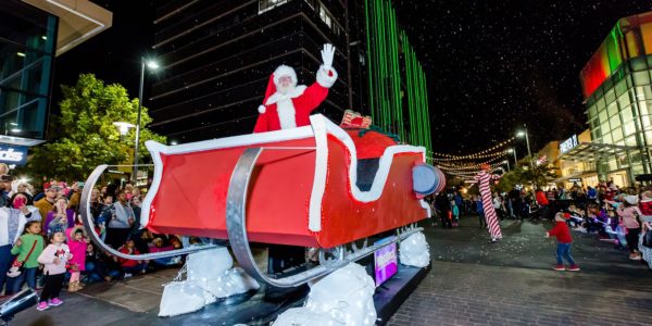 Santa on his sleigh waving at the Downtown Summerlin Holiday Parade