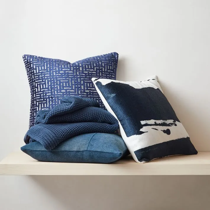 Classic Blue West Elm pillows on shelf