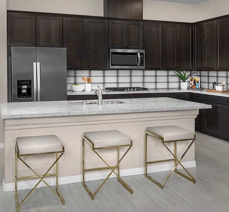 Kitchen with brown cabinets at Bristle Vale Collection II by KB Home in Summerlin