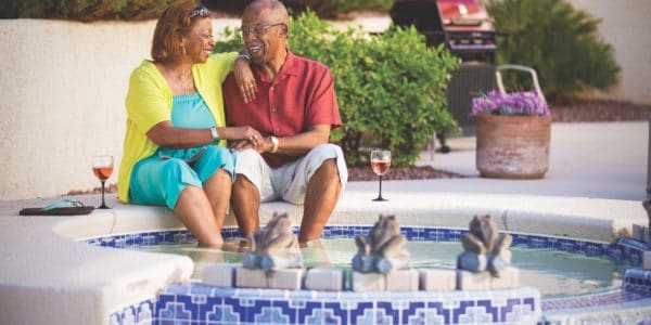 African American couple drinking wine at a hot tub in Summerlin