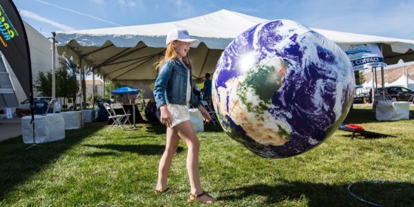 Girl with earth balloon at the Wellness Festival in Downtown Summerlin