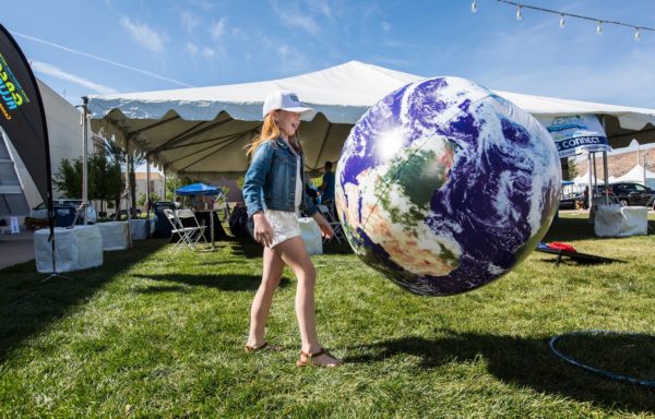 Girl with earth balloon at the Wellness Festival in Downtown Summerlin