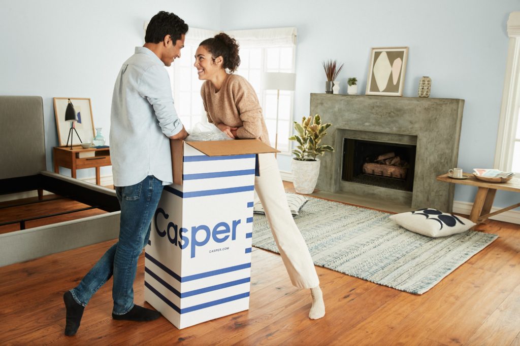 Happy Couple Opening a Casper Mattress
