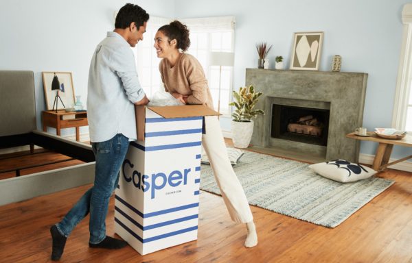 Happy Couple Opening a Casper Mattress