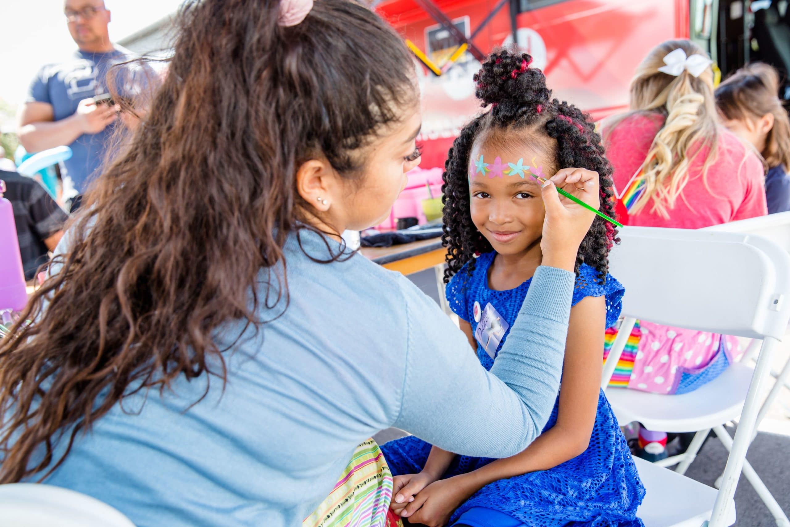 African American girl getting her face painted at the Summerlin Festival Of Arts