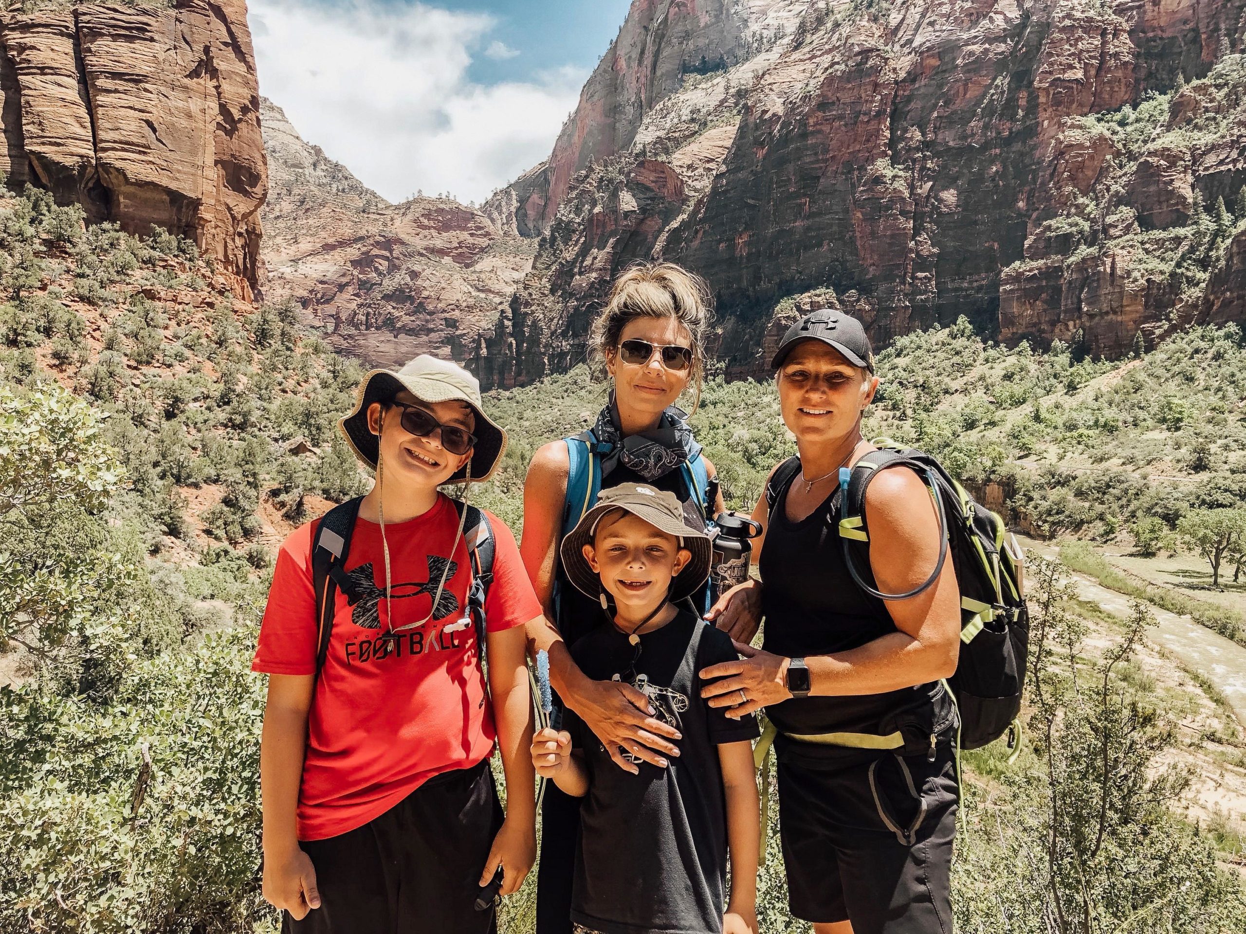 Trish and wife Janice Gallagher with family on a hike