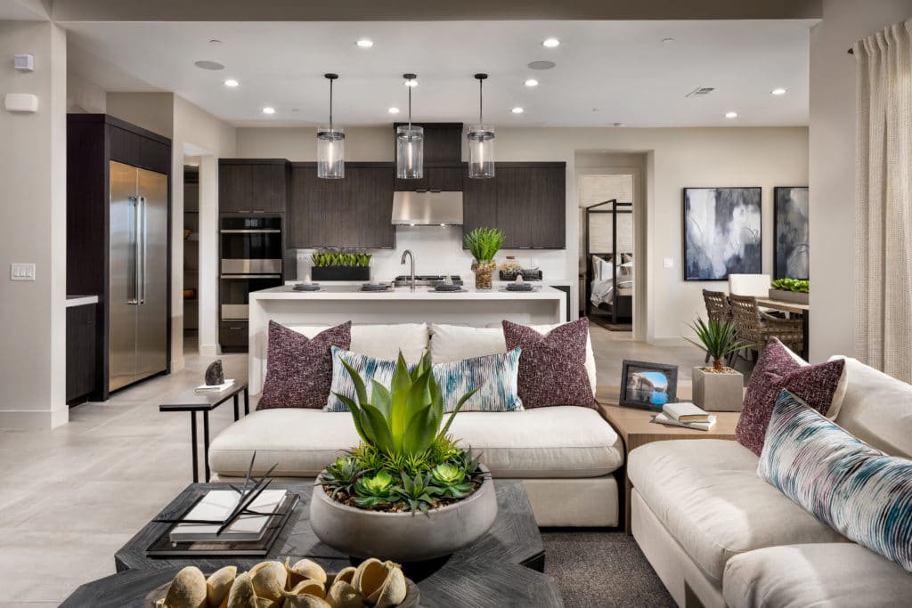 Family Room to Kitchen of Alba Elite model at Acadia Ridge by Toll Brothers