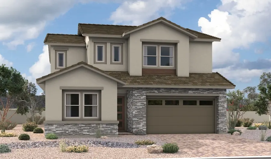 DupontLA54_C_Gen3_elev_IND_07_17_25 Two-story modern suburban house with tan stucco walls, stone accent facade, and a two-car garage. The Dupont Floorplan at Primrose Park by Richmond American Homes features desert landscaping with rocks, shrubs, and cactus under a partly cloudy sky.
