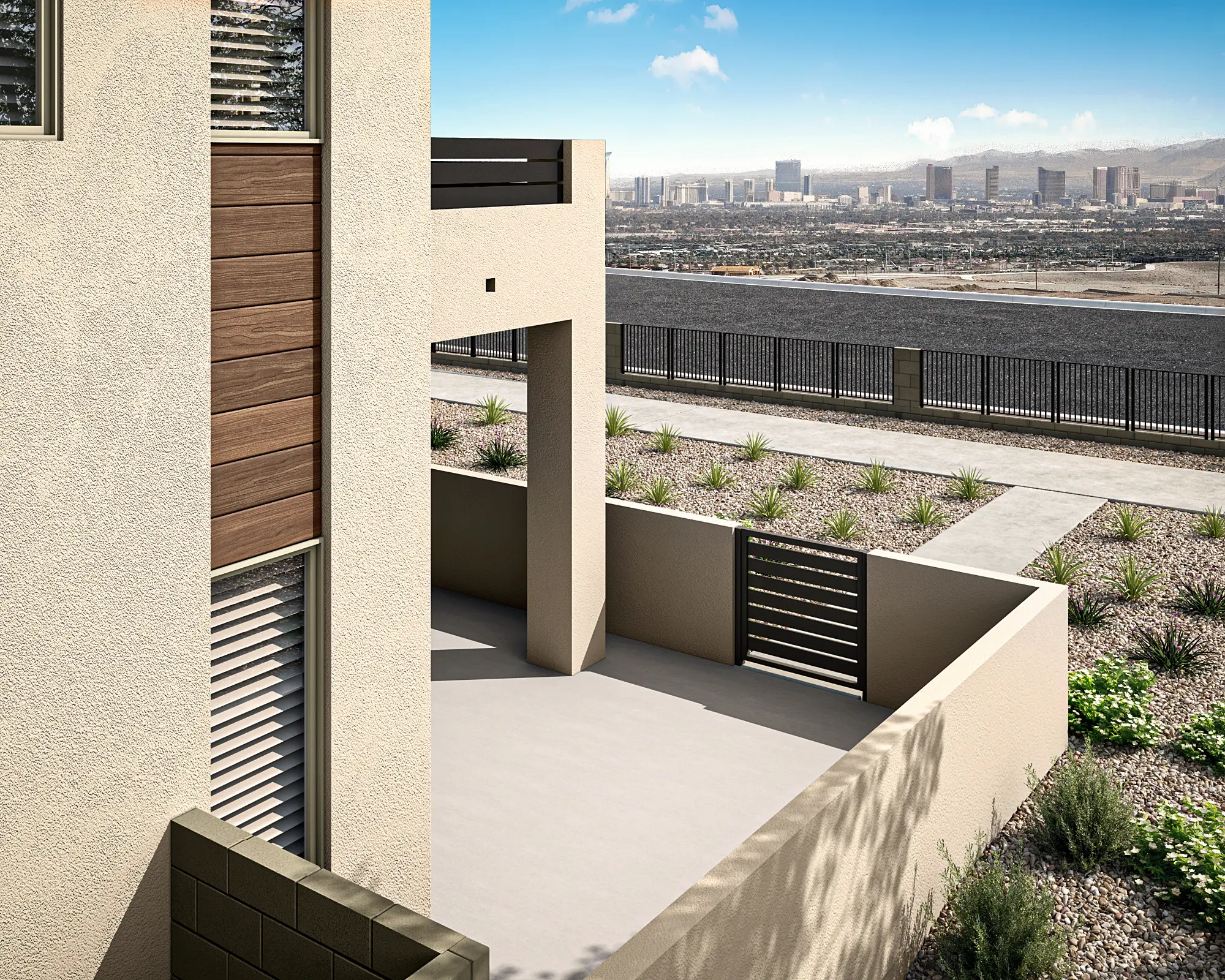 10_TP-LV-Aberdeen_Collection_ONE_HT_P2B_CS_05_rxhalt A modern house patio with beige walls and metal railings overlooks a landscaped yard with desert plants and gravel. In the distance, a city skyline sits beneath a blue sky with scattered clouds.
