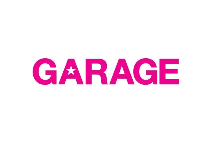 The word GARAGE is written in bold, pink capital letters on a white background. The letter A is replaced with a star symbol.