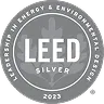 LEED2023-Silver Circular silver LEED seal with LEED SILVER 2023 in the center, a leaf design in the background, and Leadership in Energy & Environmental Design around the edge.