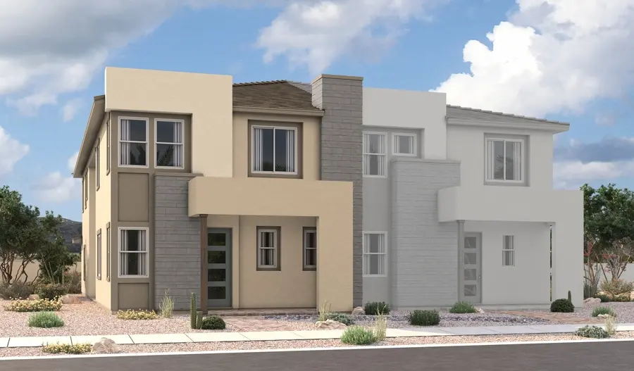 Nina-2-Elevation-C A modern two-story duplex with beige, gray, and white exterior walls, flat and sloped roof sections, large windows, and minimal desert landscaping in front. The sky is partly cloudy.
