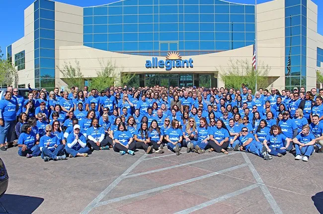 Employees of Allegiant in front of their office