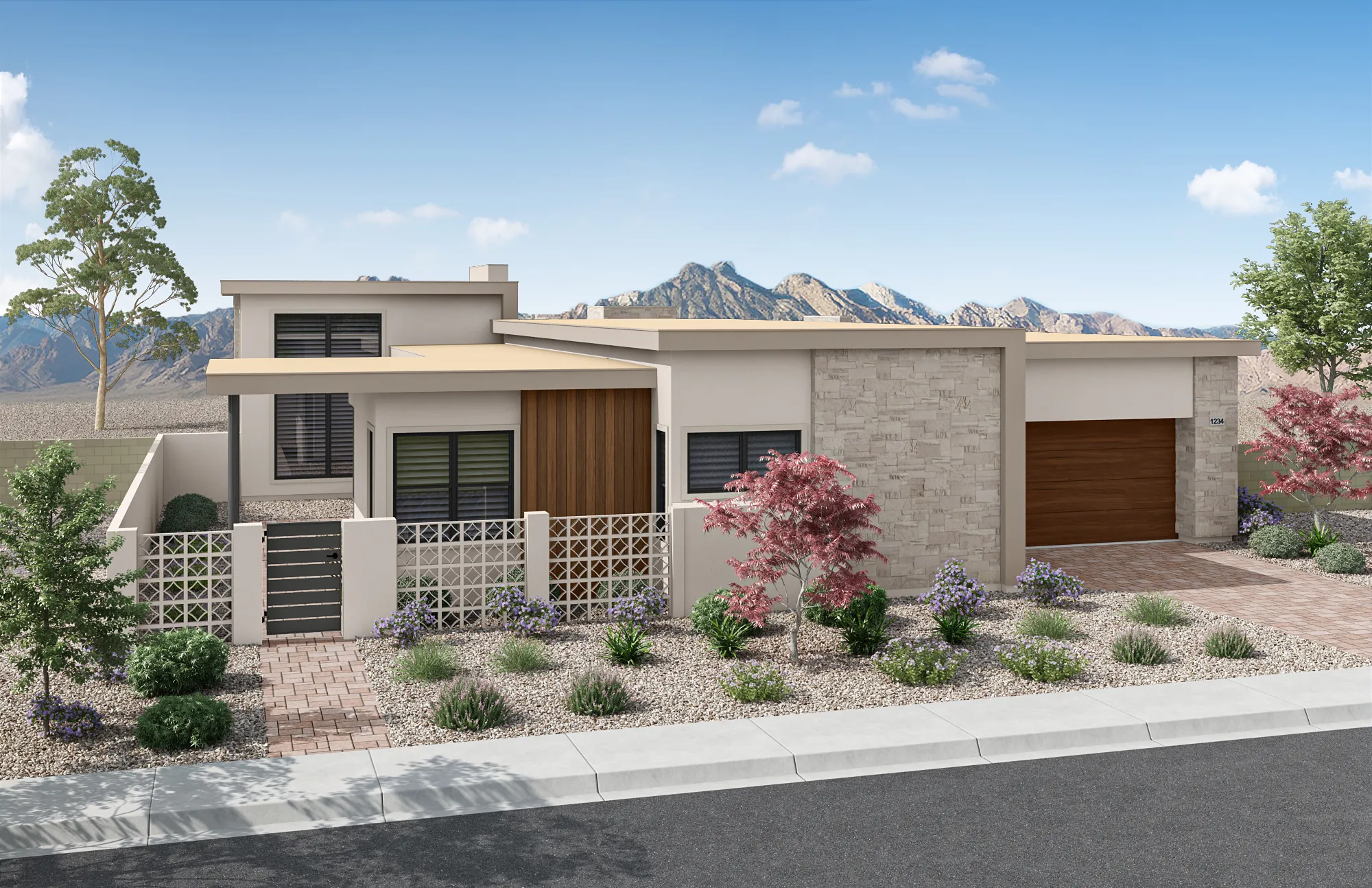 Modern single-story house with a flat roof, stone and wood accents, large windows, and a garage. Desert landscaping with rocks, shrubs, and small trees. Mountains are visible in the background under a blue sky.
